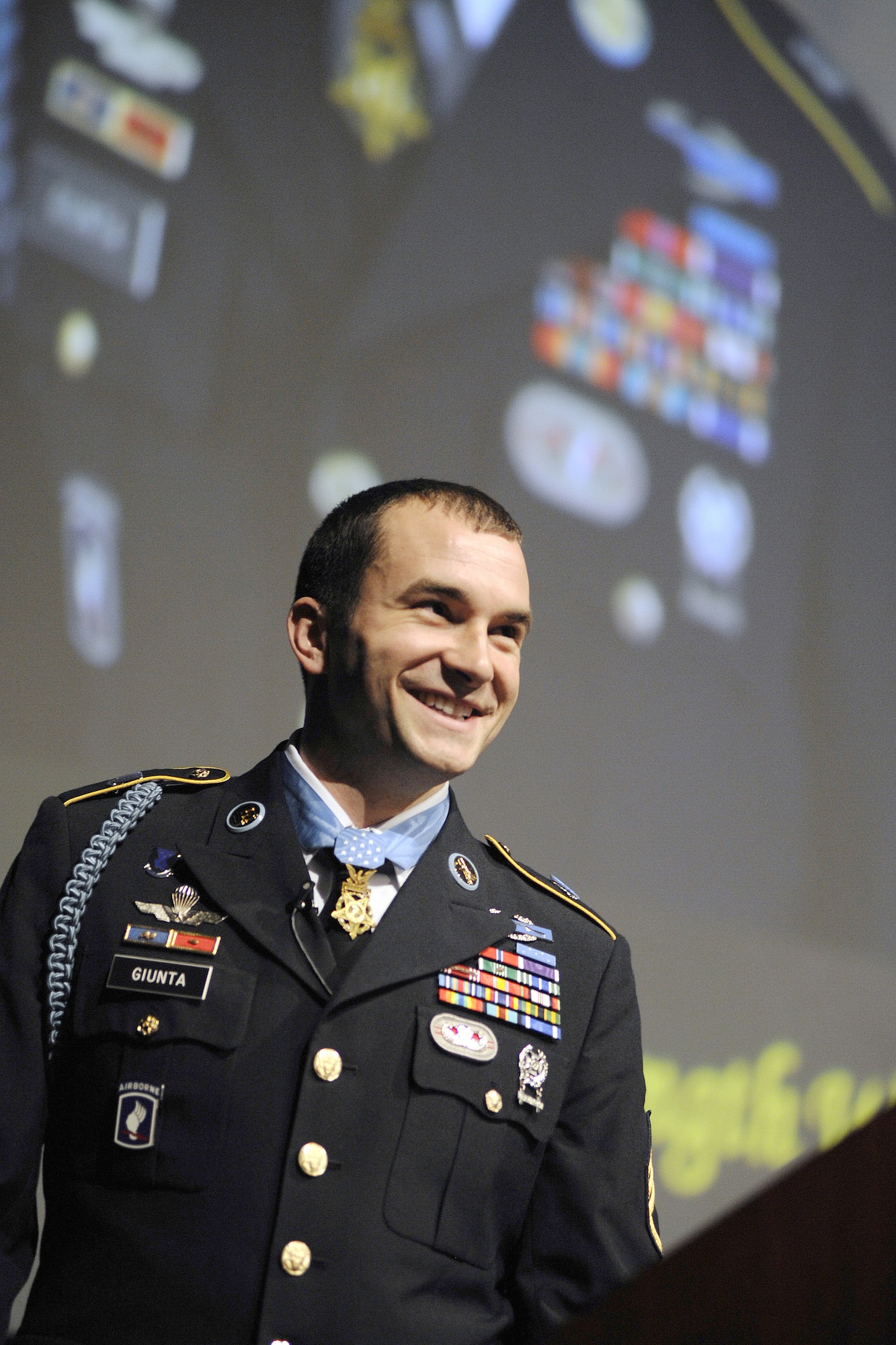Army Staff Sgt. Salvatore Giunta addresses the Air Force Academy Cadet Wing and guests during his keynote speech at the National Character and Leadership Symposium in Arnold Hall Feb. 24, 2011. Sergeant Guinta, the first living Medal of Honor recipient since the Vietnam War, was one of three Medal recipients to speak at the Center for Character and Leadership Development's keystone event. (U.S. Air Force photo/Dennis Rogers)