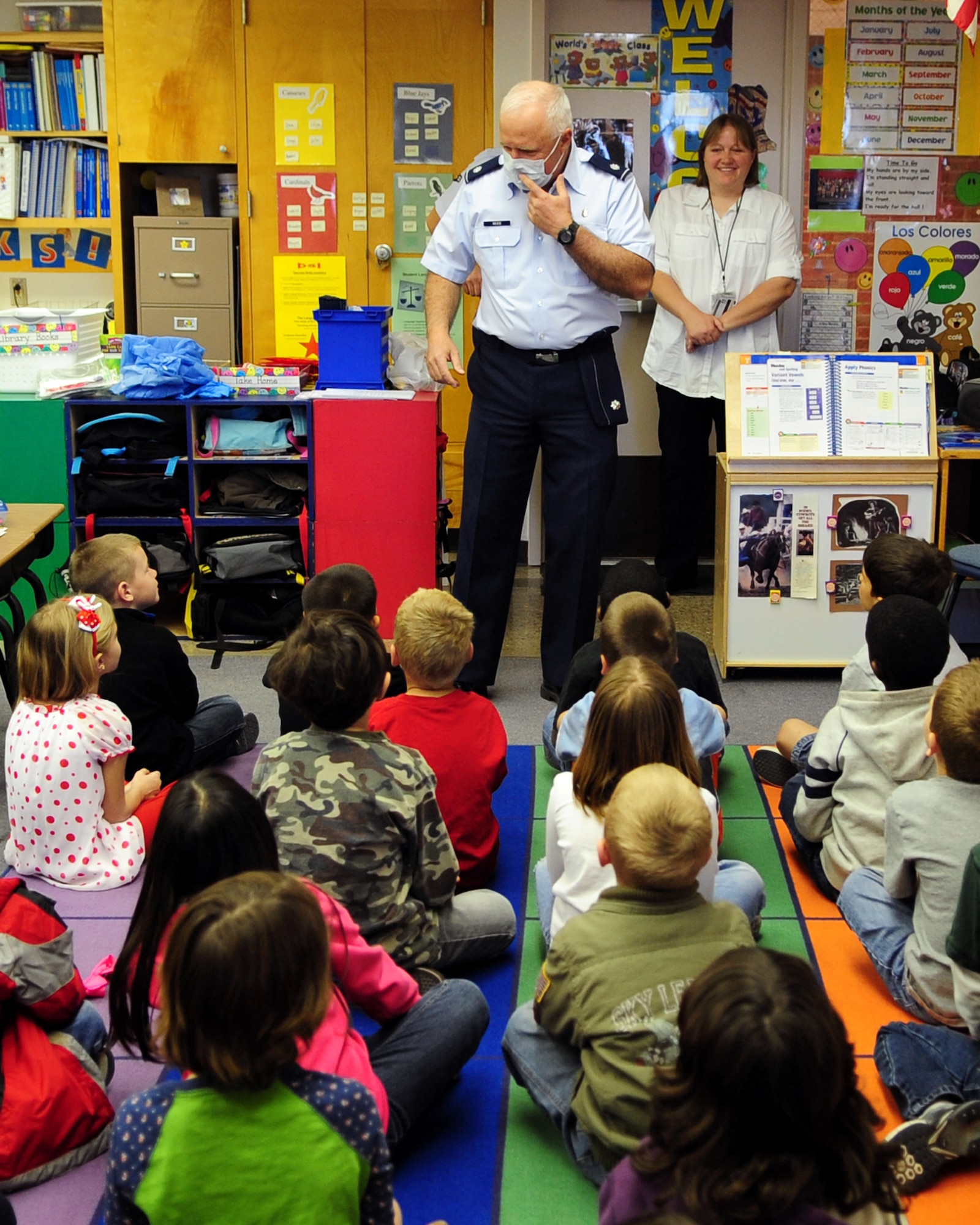 DAVIS-MONTHAN AIR FORCE BASE, Ariz. - Lt. Col. Thomas Reed, 355th Dental Squadron dentist, talks to children at Borman Elementary School about being a dentist, as part of National Children’s Dental Health month here Feb. 18. Airmen from the 355th DS visited the school to educate the children on good oral hygiene. (U.S. Air Force photo/Airman 1st Class Jerilyn Quintanilla) 