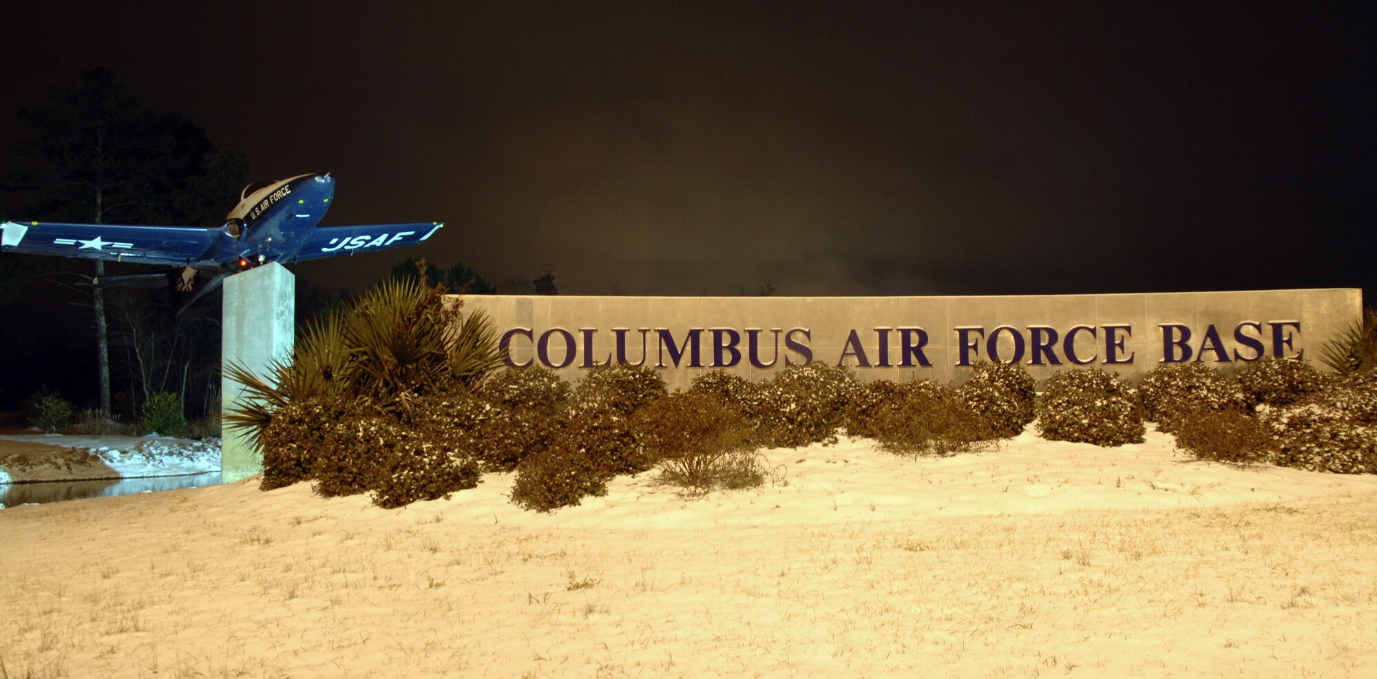 Snow falls on the Columbus Air Force Base welcome sign during a winter snow storm Jan. 9. The storm left just over three inches of snow and resulted in delayed reporting for most base members Jan. 10.