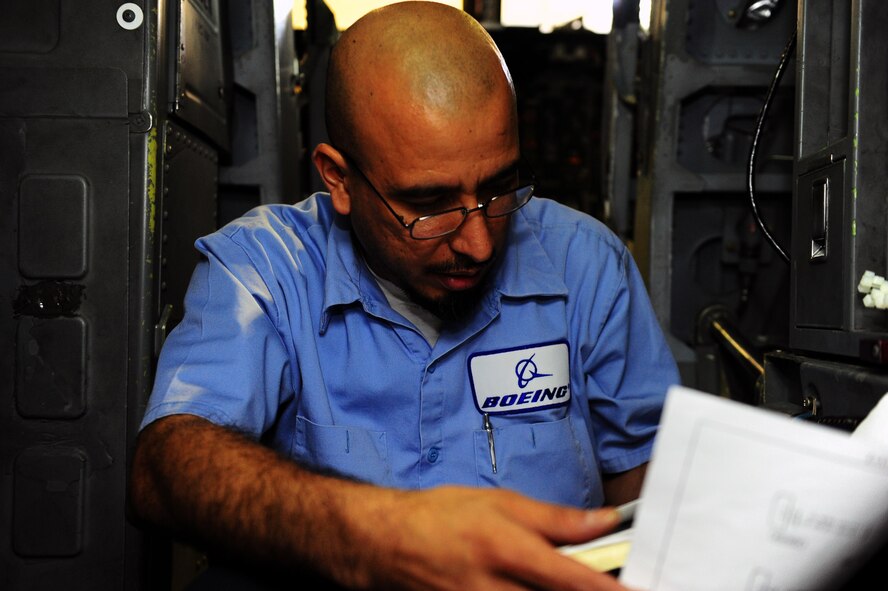DYESS AIR FORCE BASE, Texas — Danny Berumen, Boeing Company employee, reads a B-1 Bomber technical manual Feb. 24 at building 5020 here. The sniper advanced targeting pod is a long-range precision targeting system that supports the precision strike mission by providing positive target identification, autonomous tracking, coordinate generation and precise weapons guidance from extended standoff ranges supporting air-to-ground operations. (U.S. Air Force photo/ Airman 1st Class Courtney Moses) 