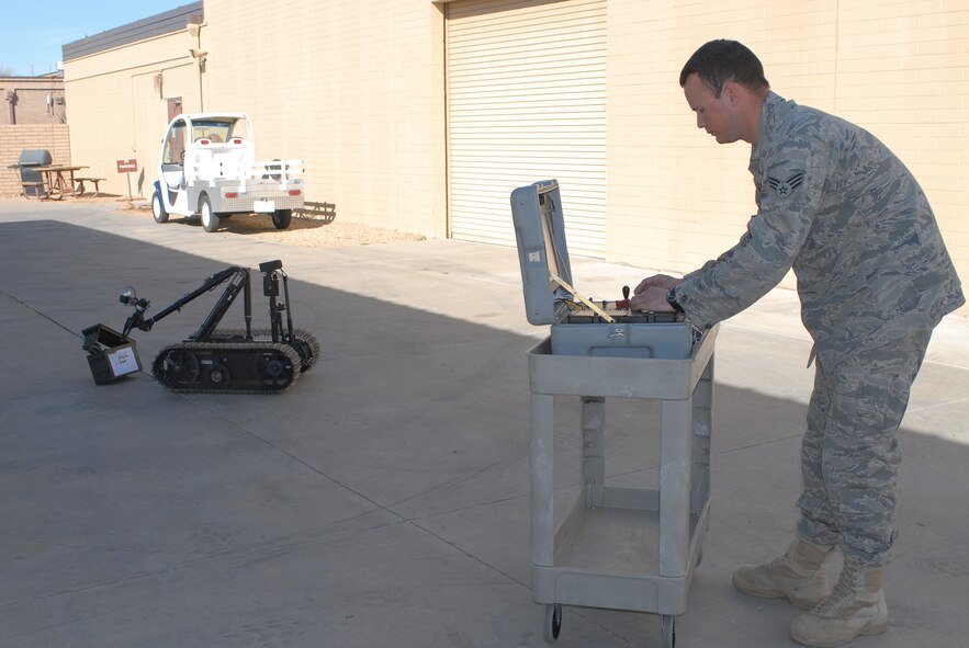 Senior Airman Edward Garwick, 56th Civil Engineer Squadron explosive ordnance disposal technician, uses a TALON robot on February 15th to remotely interrogate a simulated possible improvised explosive device.  (U.S. Air Force photo/Senior Airman Tracie Forte)