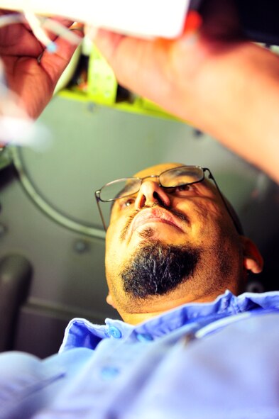 DYESS AIR FORCE BASE, Texas — Danny Berumen, Boeing Company employee, rewires a B-1 Bomber to be fitted with a sniper advanced targeting pod Feb. 24 at building 5020 here. The sniper pod is a long-range precision targeting system that supports the precision strike mission by providing positive target identification, autonomous tracking, coordinate generation and precise weapons guidance from extended standoff ranges supporting air-to-ground operations. (U.S. Air Force photo/ Airman 1st Class Courtney Moses) 