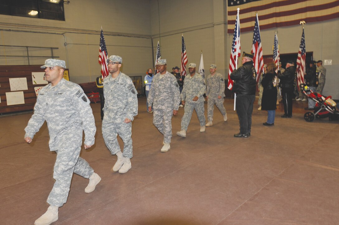 7th Sustainment Brigade Soldiers march into Anderson Field House, Fort Eustis, Wednesday night upon their return home from a yearlong deployment in support of Overseas Contingency Operations. (Photo by Sgt. 1st Class Kelly Jo Bridgwater)
