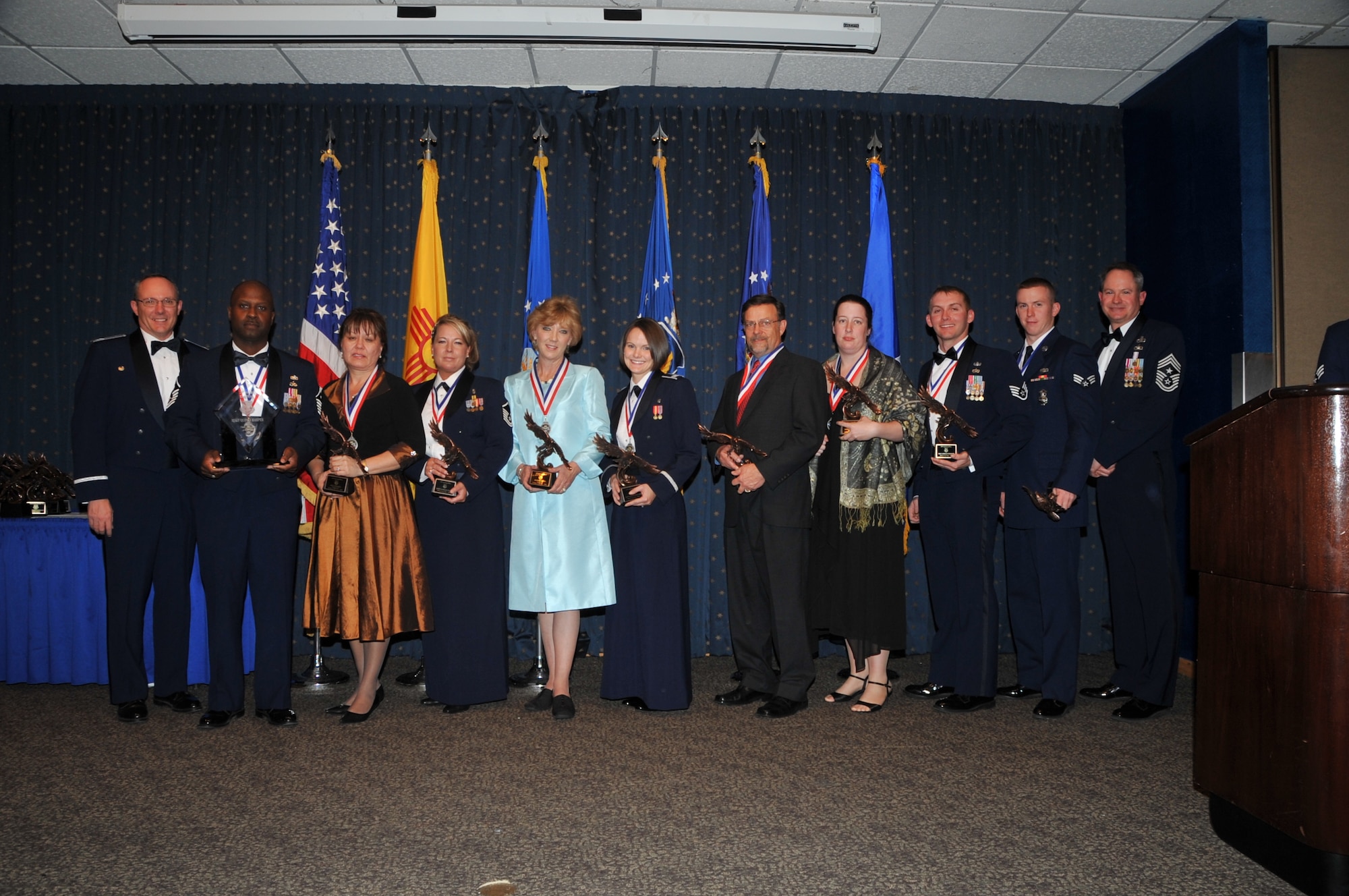 377th Air Base Wing annual award winners with Col. Robert L. Maness, 377th Air Base Wing commander, are Master Sgt. Quincy Harper, 377th ABW First Sergeant of the Year, Lisa Esparza 377th ABW Civilian of the Year Category IV, Master Sgt. Candace Stacy, 377th ABW Senior NCO of the Year, Allison Smith, 377th ABW Civilian of the Year Category I, Capt. Kristen Newsome, 377th ABW Company Grade Officer of the Year, Lawrence Garcia, 377th ABW Civilian of the Year Category III, Jamie Rodriquez, 377th ABW Civilian of the Year Category II, Staff Sgt. Jordan Bishopp, 377th ABW NCO of the Year, Senior Airman Joseph Crotty, 377th ABW Airman of the Year and Chief Master Sgt. Lee Thompson, 377th ABW command chief.  U.S. Air Force Photo by Todd Berenger