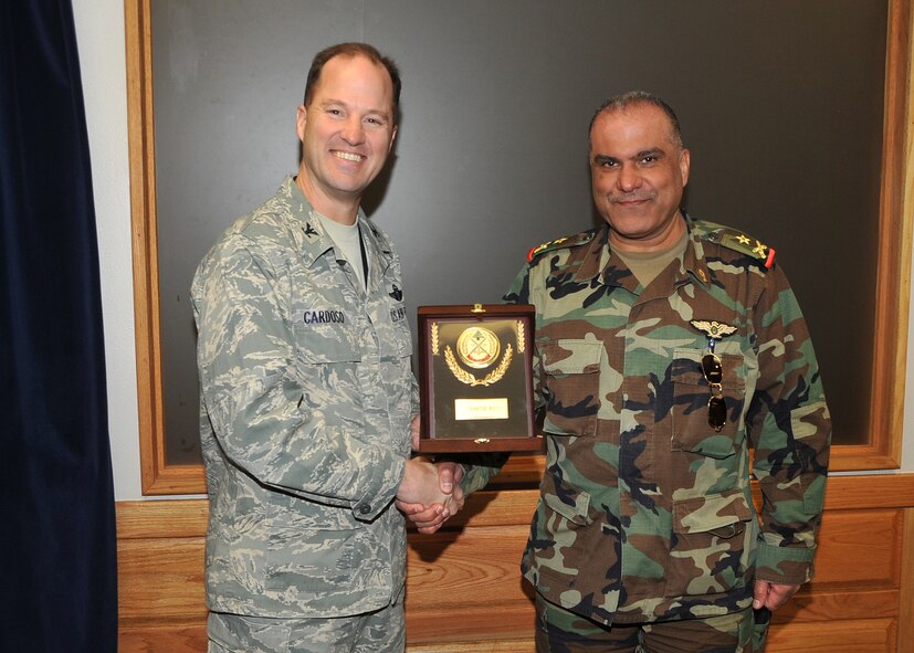 Col. James Cardoso, 58th Special Operations Wing commander, left, receives a gift from Lebanese Brig. Gen. Tarek Baltaji during a visit from Jan. 29-Feb. 4 to Kirtland Air Force Base. Brig. Gen. Baltaji, accompanied by Brig. Gen. Taha Dennawy and Beg. Gen. Rafic El Haddad, toured the 58 SOW and the Air Force Safety Center.  U.S. Air Force Photo by Todd Berenger