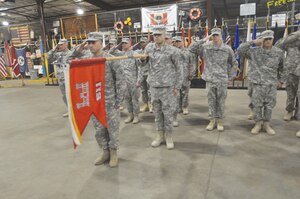 Army divers assigned to the 511th Dive Detachment, Special Troops Battalion, 7th Sustainment Brigade, stand before family and friends at Fort Eustis during an early morning welcome home ceremony. The 511th returned home upon their successful completion of a 12-month deployment to Kuwait Naval Base. (Photo by Sgt. 1st Class Kelly Jo Bridgwater)