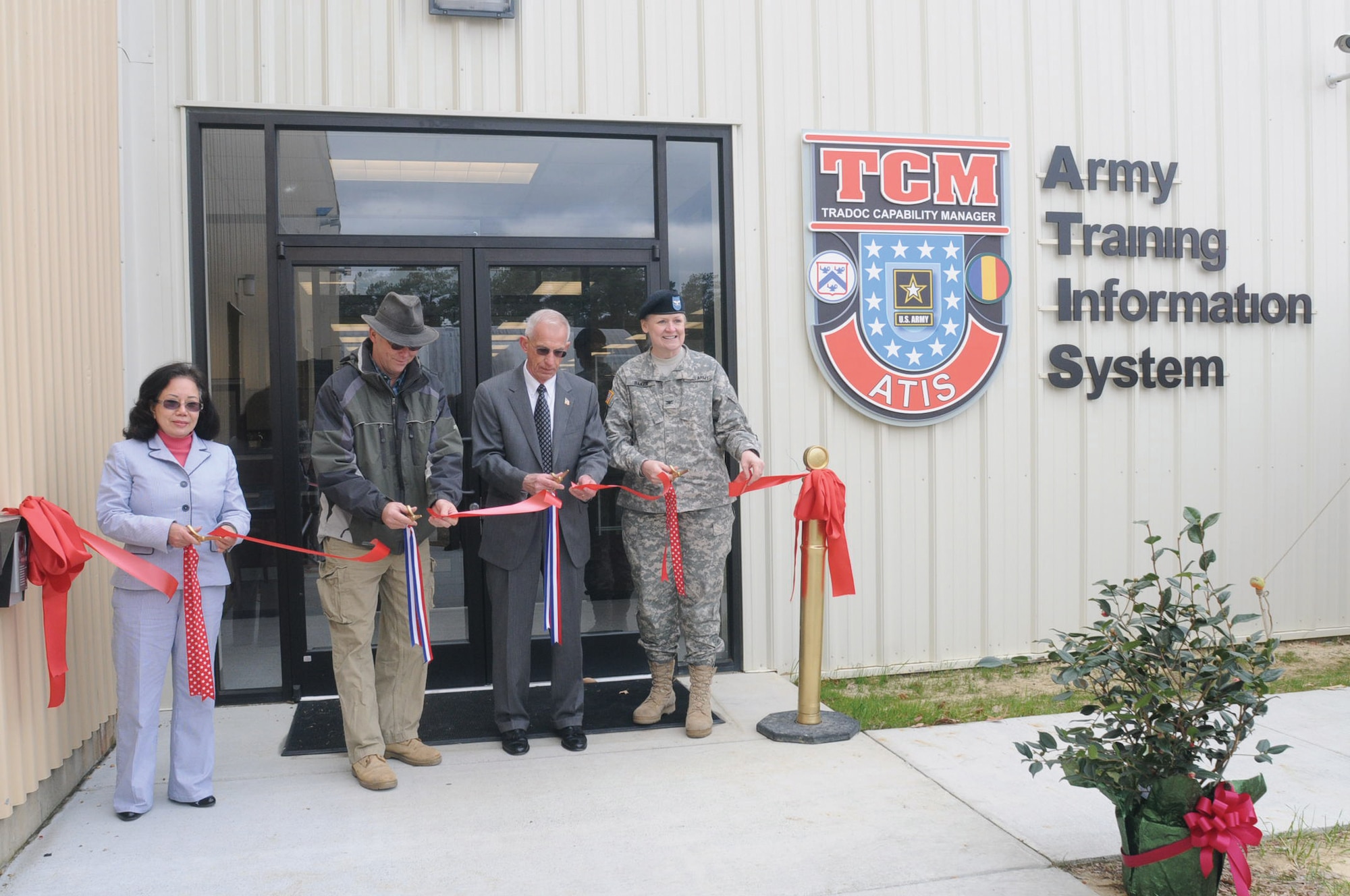 (From left) Hue Mai, 733d Civil Engineer Division project manager, Kenny Bone, senior project manager, Larry Matthews, U.S. Army Training and Doctrine Command Capability Manager-Army Training Information Center director, and Col. Sharon Baker, Army Training Support Center commander, cut the ribbon during the grand opening Tuesday of the TCM-ATIS’ new annex at Bldg. 3308, Wilson Ave., Fort Eustis. (Photo by Lyna Tucker)


