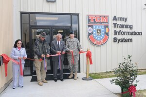 (From left) Hue Mai, 733d Civil Engineer Division project manager, Kenny Bone, senior project manager, Larry Matthews, U.S. Army Training and Doctrine Command Capability Manager-Army Training Information Center director, and Col. Sharon Baker, Army Training Support Center commander, cut the ribbon during the grand opening Tuesday of the TCM-ATIS’ new annex at Bldg. 3308, Wilson Ave., Fort Eustis. (Photo by Lyna Tucker)


