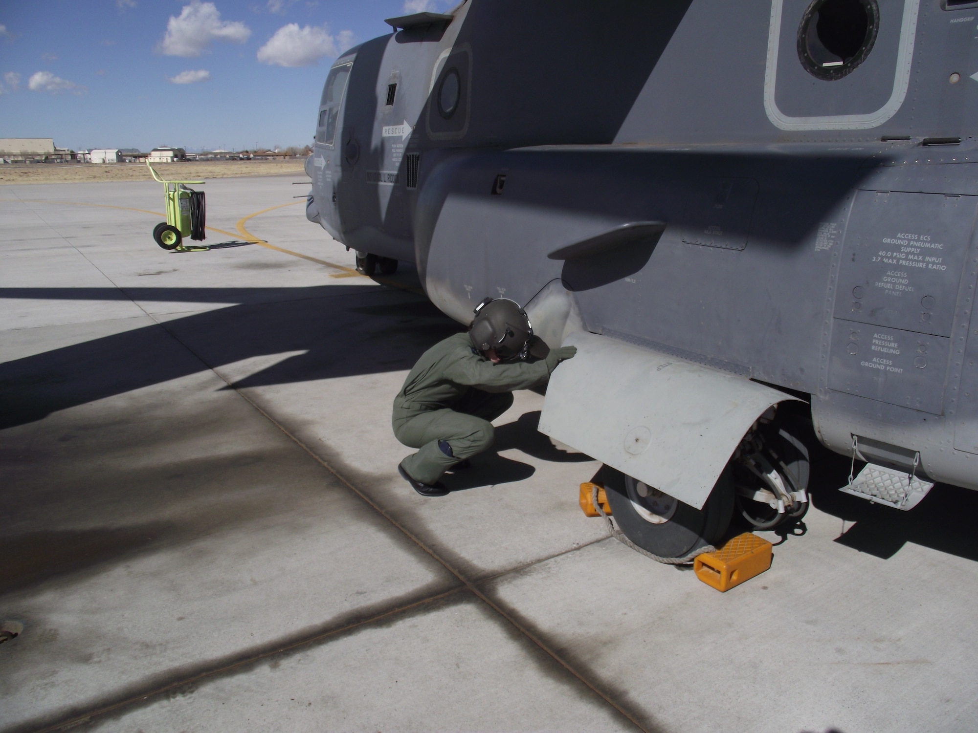 1st Lt. Candice Killian, 58th Training Squadron, does a preflight check on the CV-22.  U.S. Air Force Photo by Stefan Bocchino