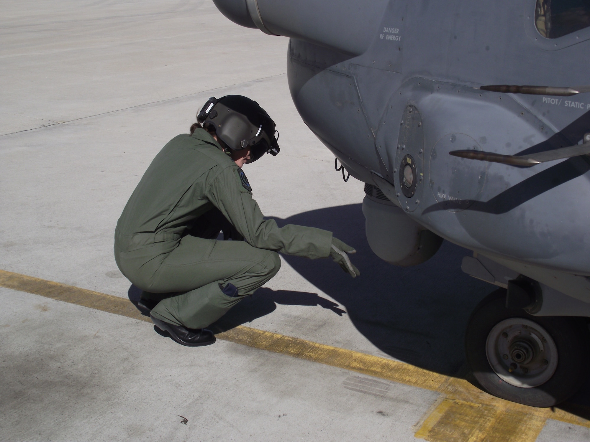 1st Lt. Candice Killian checks key components of the CV-22 during a preflight inspection.  U.S. Air Force Photo by Stefan Bocchino