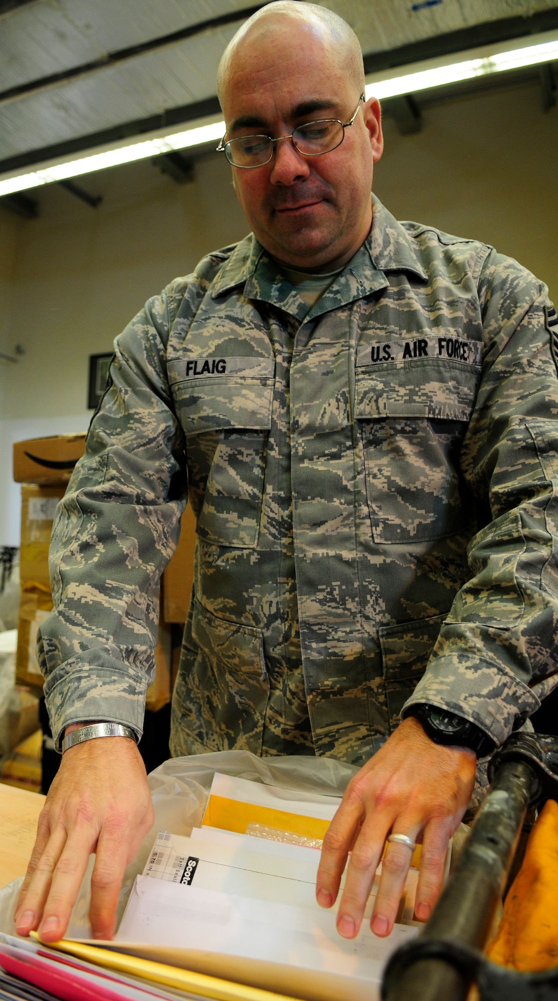 Senior Master Sgt. George Flaig, Aviano Post Office postal superintendent, sorts through mail Feb. 2. Sergeant Flaig recently earned the Outstanding Postal Service Senior NCO award at the U.S. Air Forces in Europe level for his dedicated service at the post office. Sergeant Flaig is responsible for overseeing postal functions and led his team to winning the 2010 U.S. Air Forces in Europe John P. Jumper Award for Outstanding Large Postal Facility. (U.S. Air Force photo by Airman 1st Class Katherine Windish)