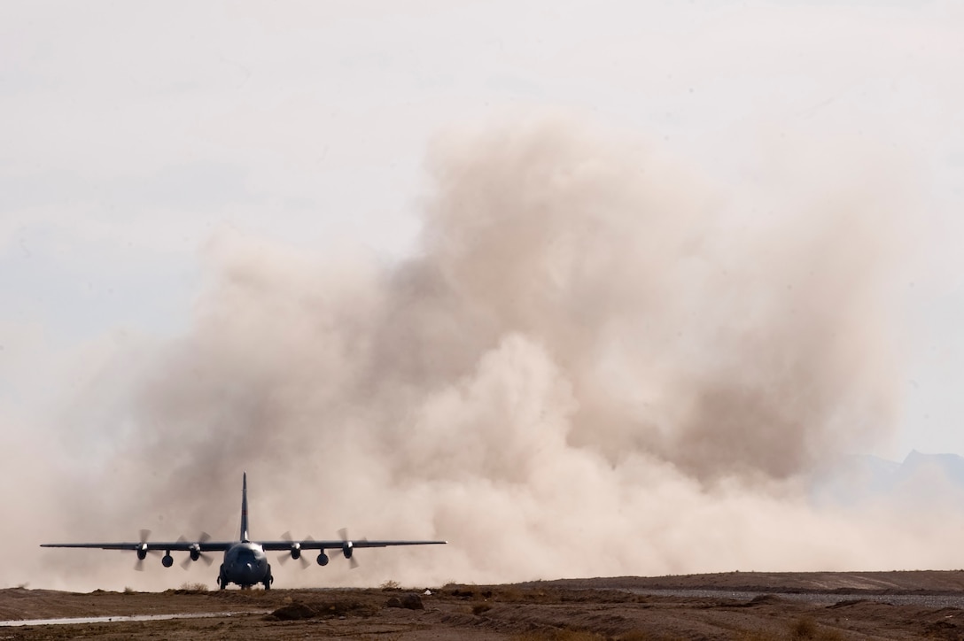A C-130 Hercules prepares to depart a dirt landing zone in the Zabul Province of Afghanistan.Airmen from the 807th Expeditionary Air Support Operations Squadron, Forward Operating Base Lagman, made sure the dirt landing zone was safe for the cargo carrying C-130 Hercules to land and depart and provided the aircrew with any pertinent information via radio communications. The aircrew was delivering needed cargo for one of the nearby military outposts. (U.S. Air Force Photo/ Master Sgt. Adrian Cadiz)(Released)