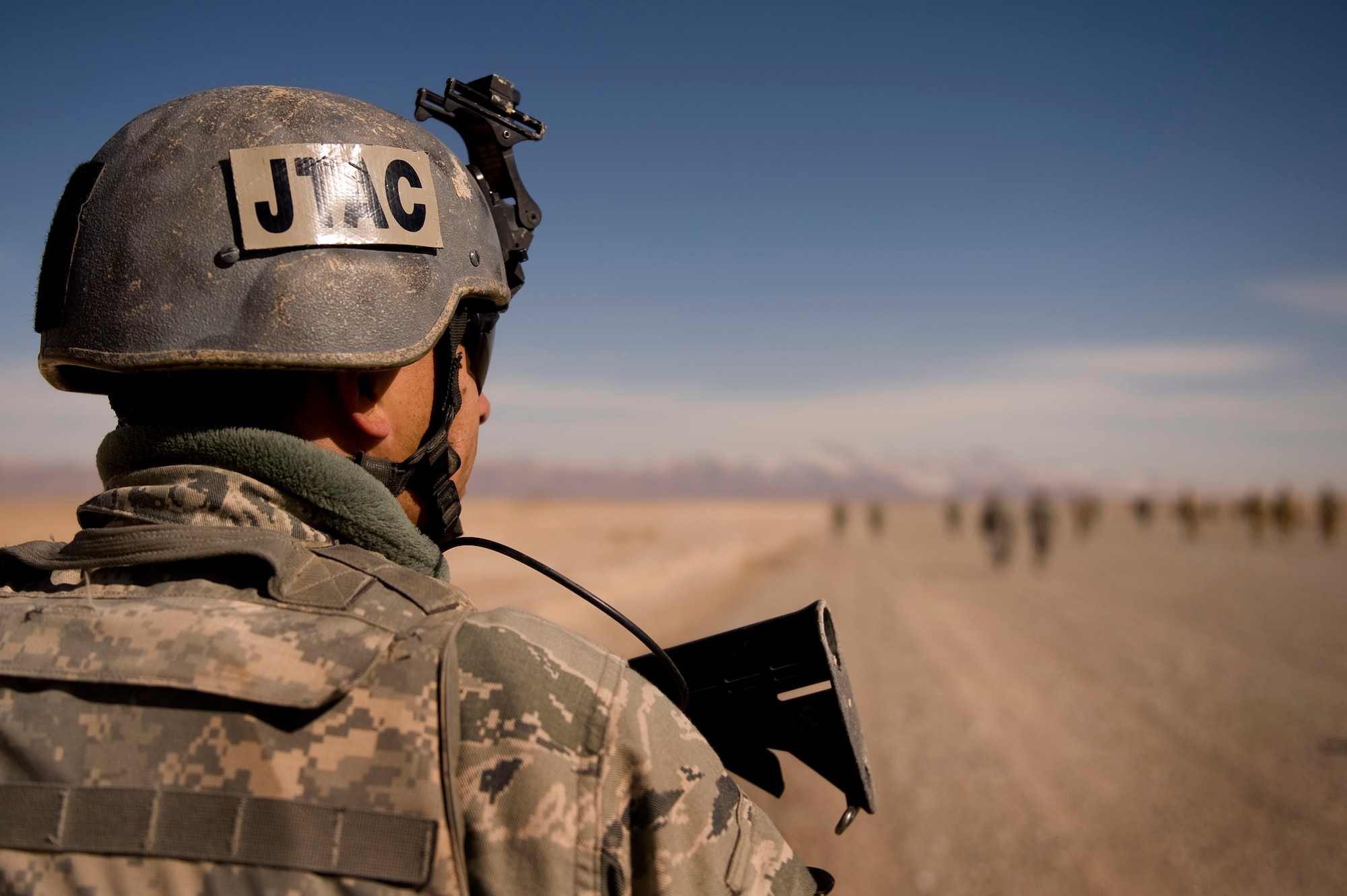 Senior Airman Jesse Medrano, Joint Terminal Air Controller, 807th Expeditionary Air Support Operations Squadron, Forward Operating Base Lagman, Afghanistan, deployed from the 10th Air Support Operations Squadron, Ft. Riley, Kan., conducts a foreign object debris walk and inspection of a dirt landing zone in the Zabul Province of Afghanistan near FOB Lagman as part of the hands onl portion of a Landing Zone Safety Officer (LZSO) class. The class consisted of U.S. Air Force, Army, and Romanian Army personnel who were there to be certified to safely run the dirt landing and drop zone. The class was taught by was taught by U.S. Air Force instructors from Combined Joint Task Force 101, Headquarters Air Mobility Liaison Office. (U.S. Air Force Photo/ Master Sgt. Adrian Cadiz)(Released)