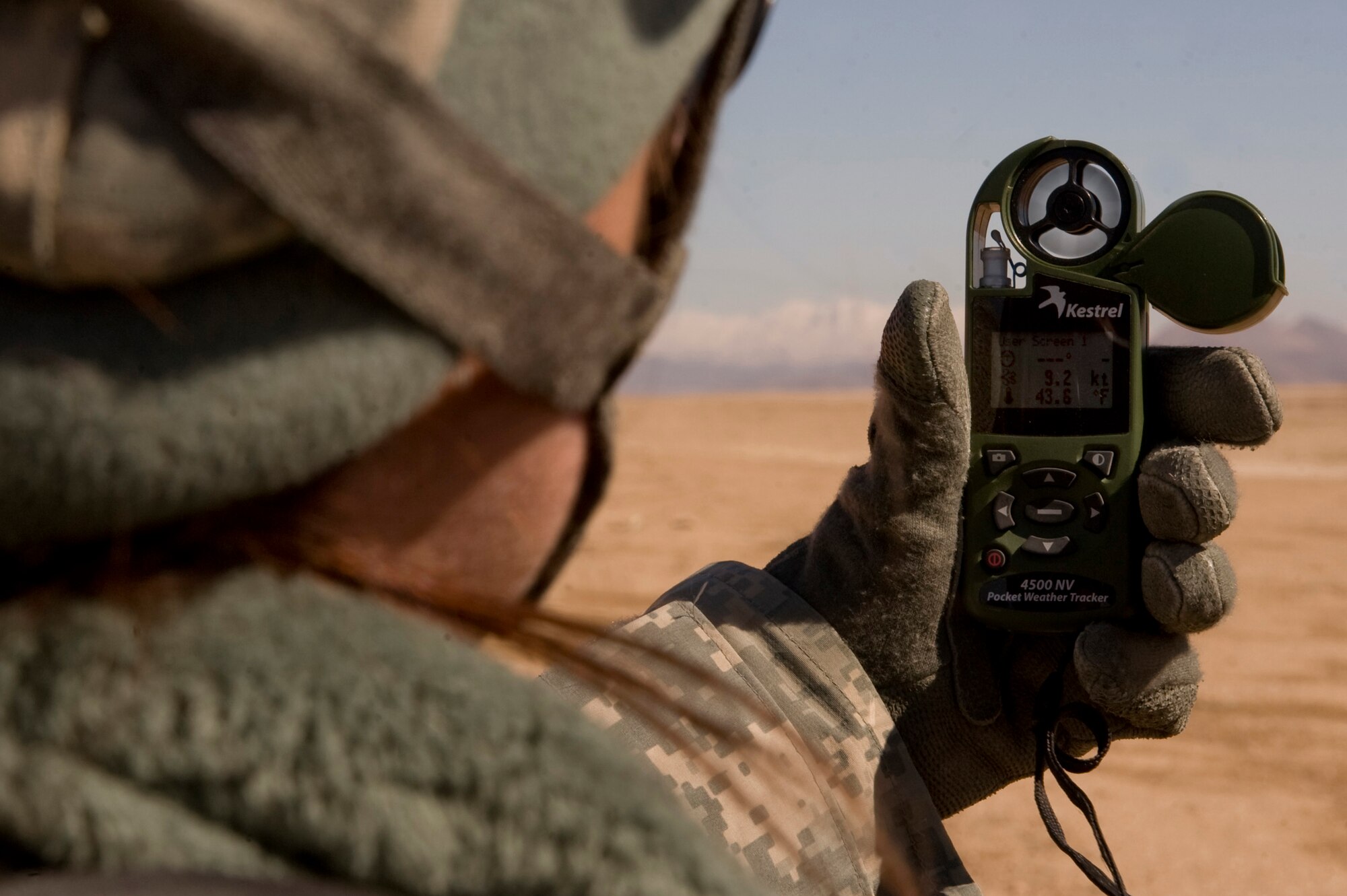 Sgt. Elizabeth Ellison, 2nd Stryker Cavalry Regiment Helo Landing Zone Control Officer takes a wind reading prior to an Afghan C-27 aircraft training bundle air delivery a at a  drop zone in the Zabul Province of Afghanistan near FOB Lagman during the hands on portion of a Landing Zone Safety Officer (LZSO) class. The class consisted of U.S. Air Force, Army, and Romanian Army personnel who were there to be certified to safely run the dirt landing and drop zone. The class was  taught by U.S. Air Force instructors from Combined Joint Task Force 101, Headquarters Air Mobility Liaison Office.(U.S. Air Force Photo/ Master Sgt. Adrian Cadiz)(Released)

