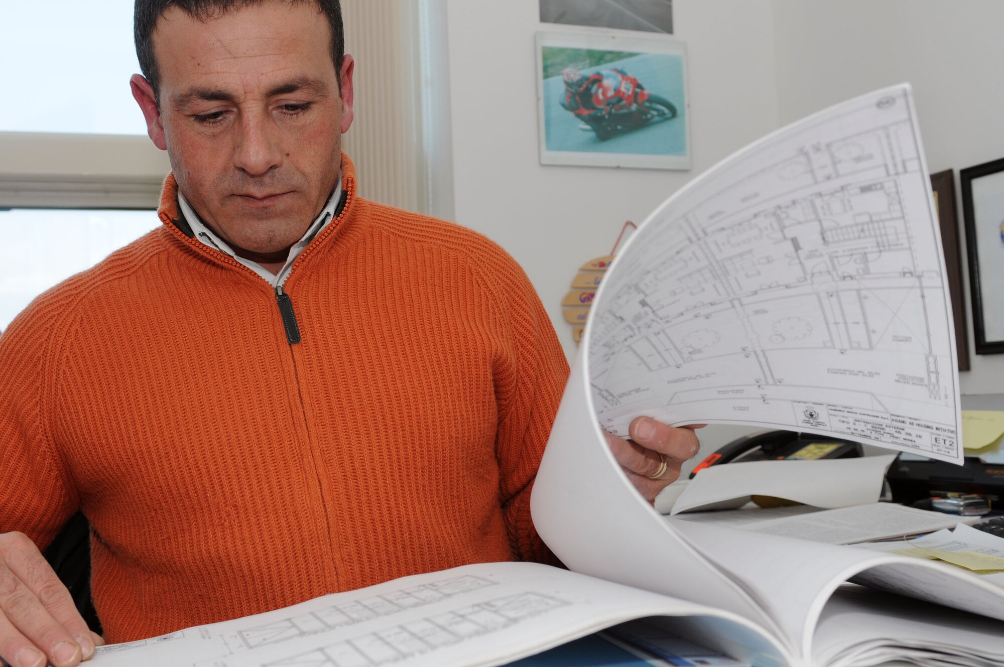Antonio Saponaro 31st Civil Engineer Squadron Housing Office facilities chief, reviews base plans Feb. 23. Mr. Saponaro recently received the 2010 U.S. Air Forces in Europe Civil Engineer Professional Housing Management-Mid Level Housing Manager of the Year award. (U.S. Air Force photo/Staff Sgt. Julius Delos Reyes)