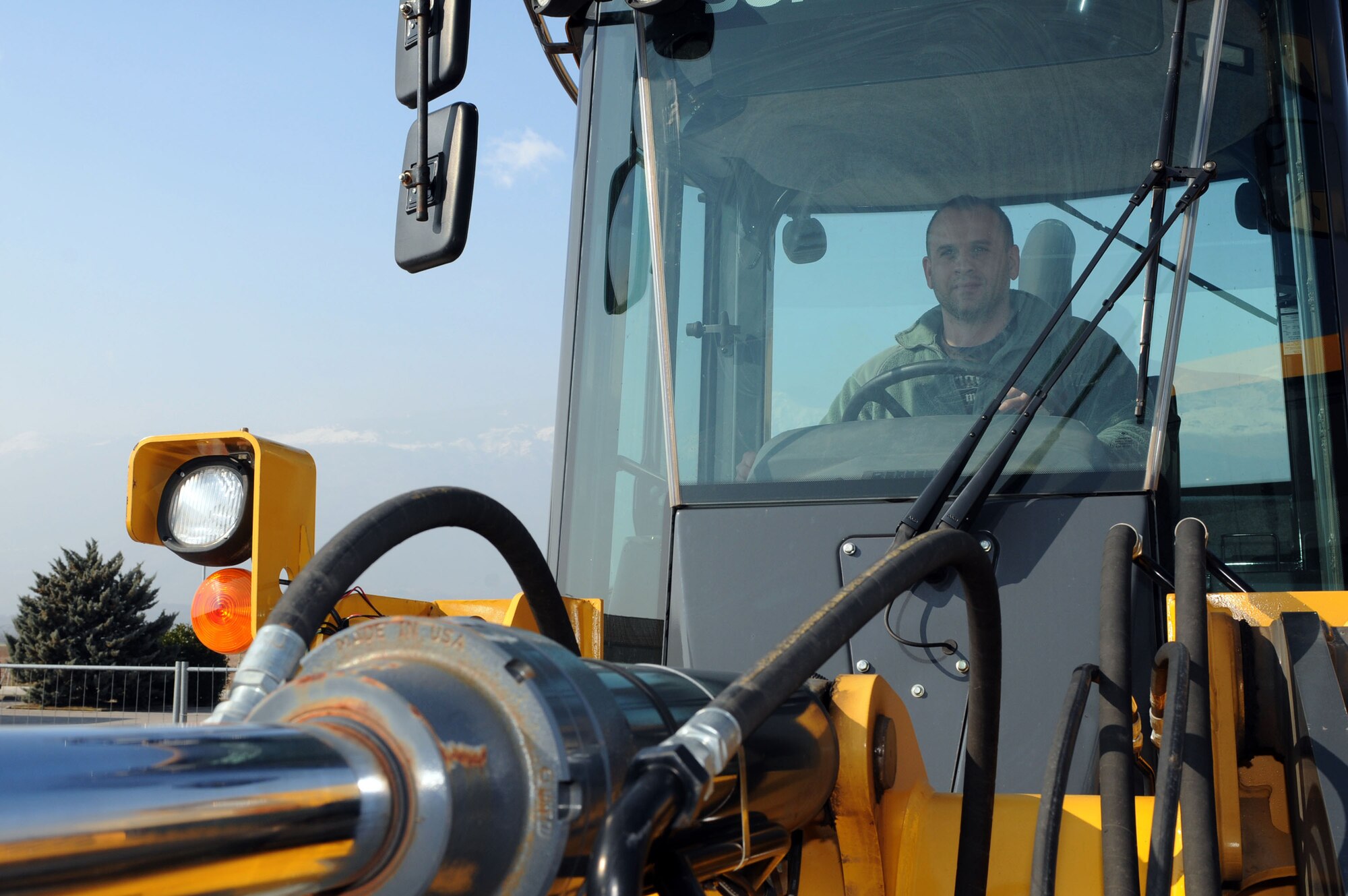 Paolo Pivetta, 31st Civil Engineer Squadron ground maintenance supervisor, operates a tractor Feb. 23. Mr. Pivetta recently received the 2010 U.S. Air Forces in Europe Civil Engineer Outstanding CE Manager-Civilian Technician of the Year award. (U.S. Air Force photo/Staff Sgt. Julius Delos Reyes)