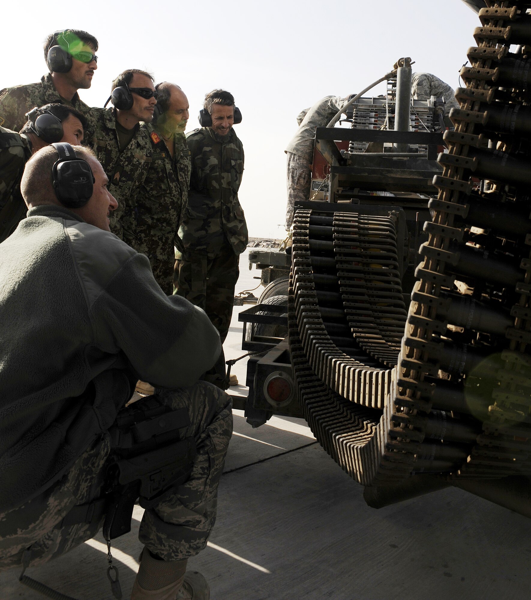 Master Sgt. Scott Blakeman describes the workings of the ammunition loading adapter for an A-10C Thunderbolt II during a demonstration for the Afghan air force, Feb. 22, 2011, at Kandahar Airfield, Afghanistan. Airman advisors teach classes to the Afghans with the hope that they can someday be a strong global partner. Sgt. Blakeman is a weapons flight chief assigned to the 451st Expeditionary Aircraft Maintenance Squadron. (U.S. Air Force photo/Senior Airman Willard E. Grande II/Released)