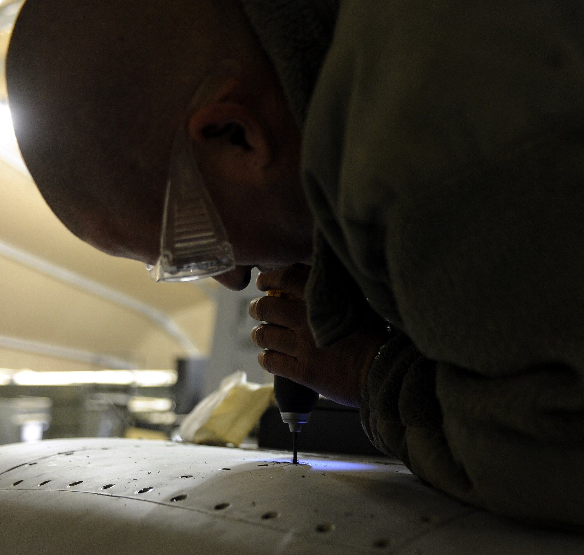 Staff Sgt Jonathan Shipp removes stuck screws from an access panel of an A-10C Thunderbolt II during a phase inspection, Feb. 22, 2011, at Kandahar Airfield, Afghanistan. The 451st Air Expeditionary Wing?s Expeditionary Maintenance Squadron conducts a phase inspection every 500 flight hours. Twenty inspections have been conducted in the past five months indentifying and repairing more than 6,000 total discrepancies. Sergeant Shipp is an aircraft structural maintenance craftsman assigned to the 451st EMXS. (U.S. Air Force photo/Senior Airman Willard E. Grande II/Released)