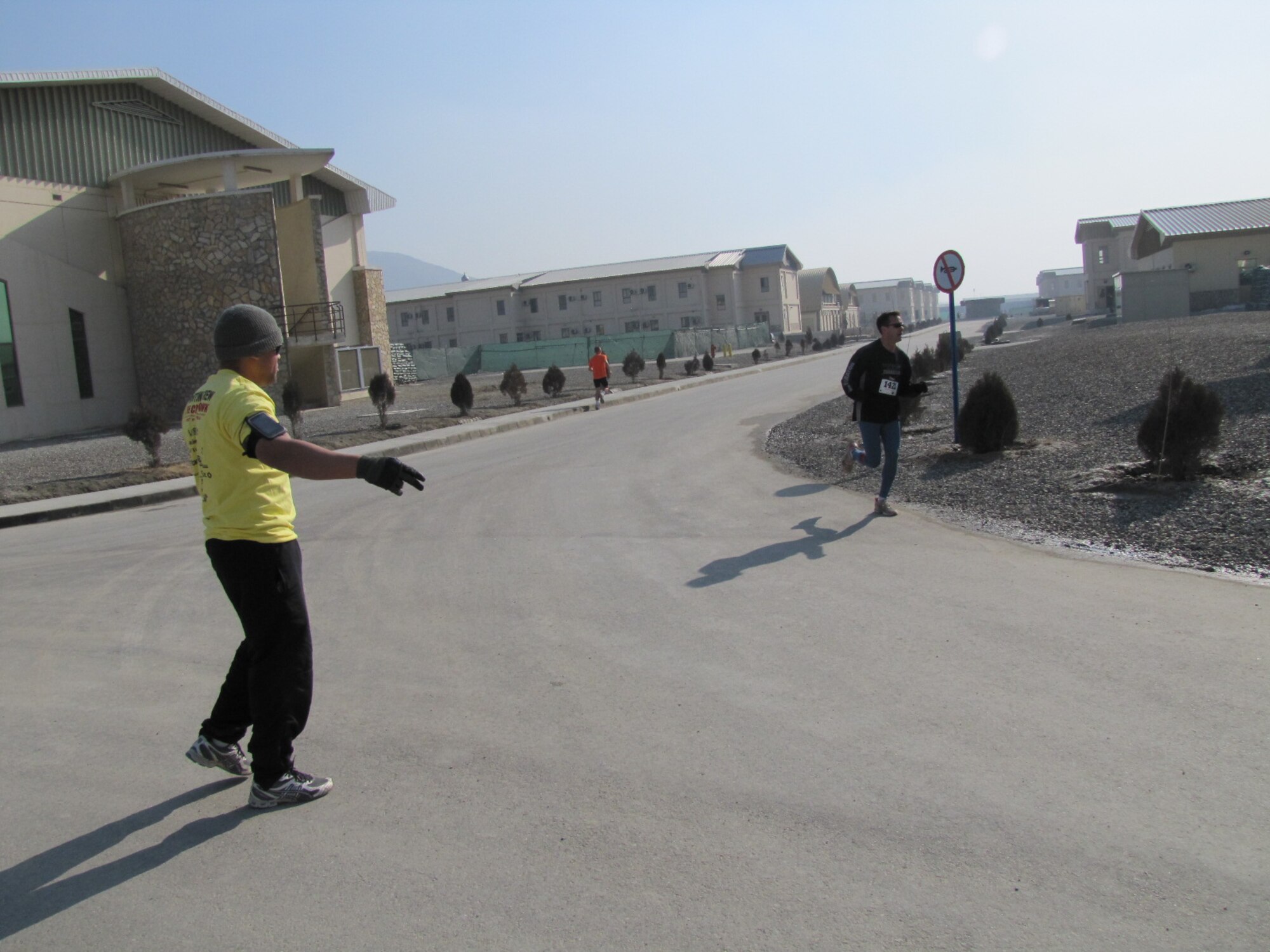 KABUL, Afghanistan - Members of the NATO Air Training Command - Afghanistan and ISAF Joint Command run the annual Fort Worth Cowtown race, one of the largest multi-event road races in the United States, at the Kabul International Airport, Afghanistan Feb 25. (U.S. Air Force photo by Capt. Rob Leese).
