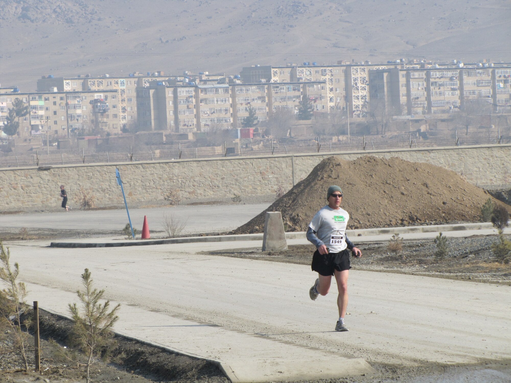 KABUL, Afghanistan - Members of the NATO Air Training Command - Afghanistan and ISAF Joint Command run the annual Fort Worth Cowtown race, one of the largest multi-event road races in the United States, at the Kabul International Airport, Afghanistan Feb 25. (U.S. Air Force photo by Capt. Rob Leese).