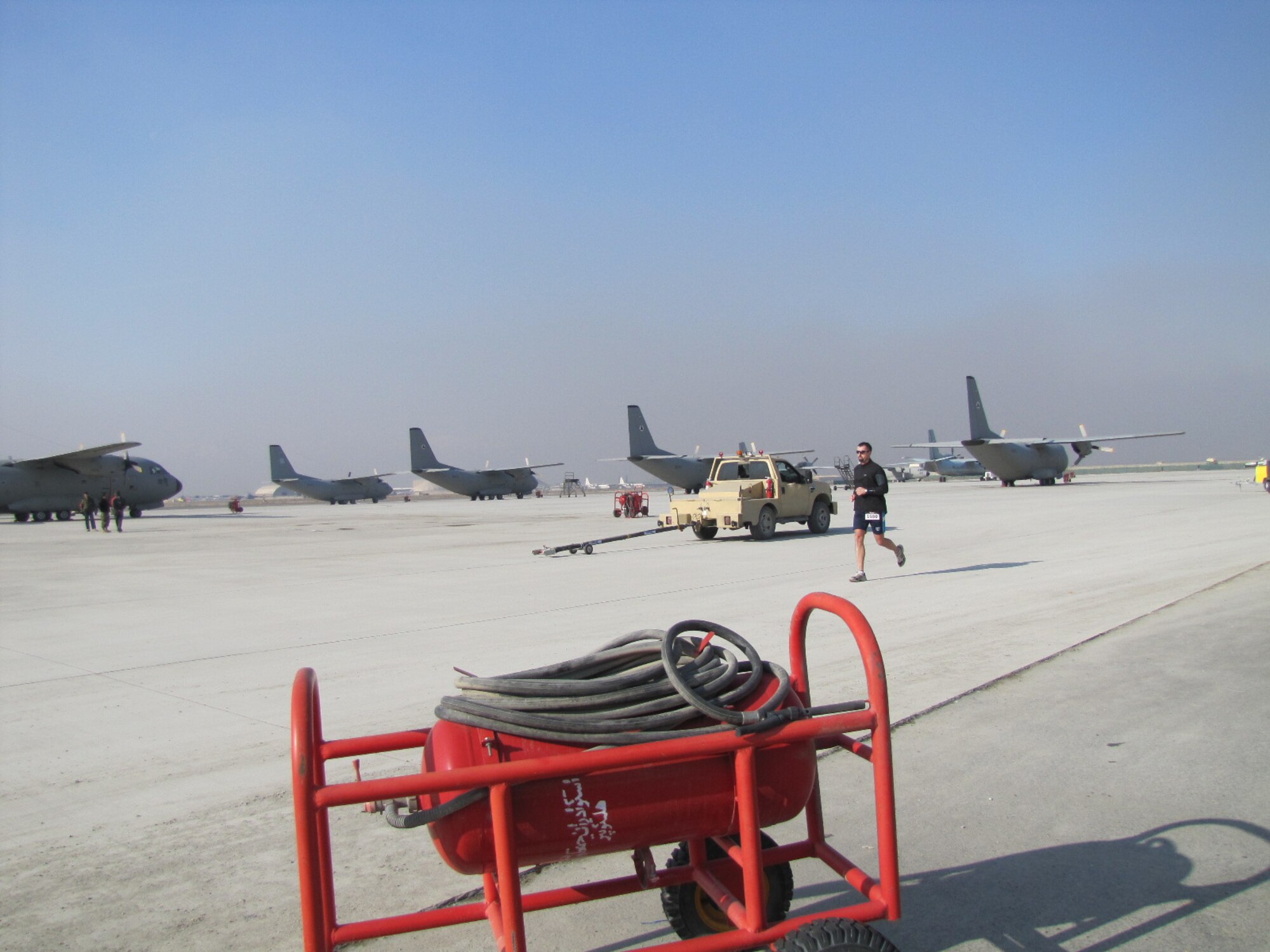 KABUL, Afghanistan - Members of the NATO Air Training Command - Afghanistan and ISAF Joint Command run the annual Fort Worth Cowtown race, one of the largest multi-event road races in the United States, at the Kabul International Airport, Afghanistan Feb 25. (U.S. Air Force photo by Capt. Rob Leese).
