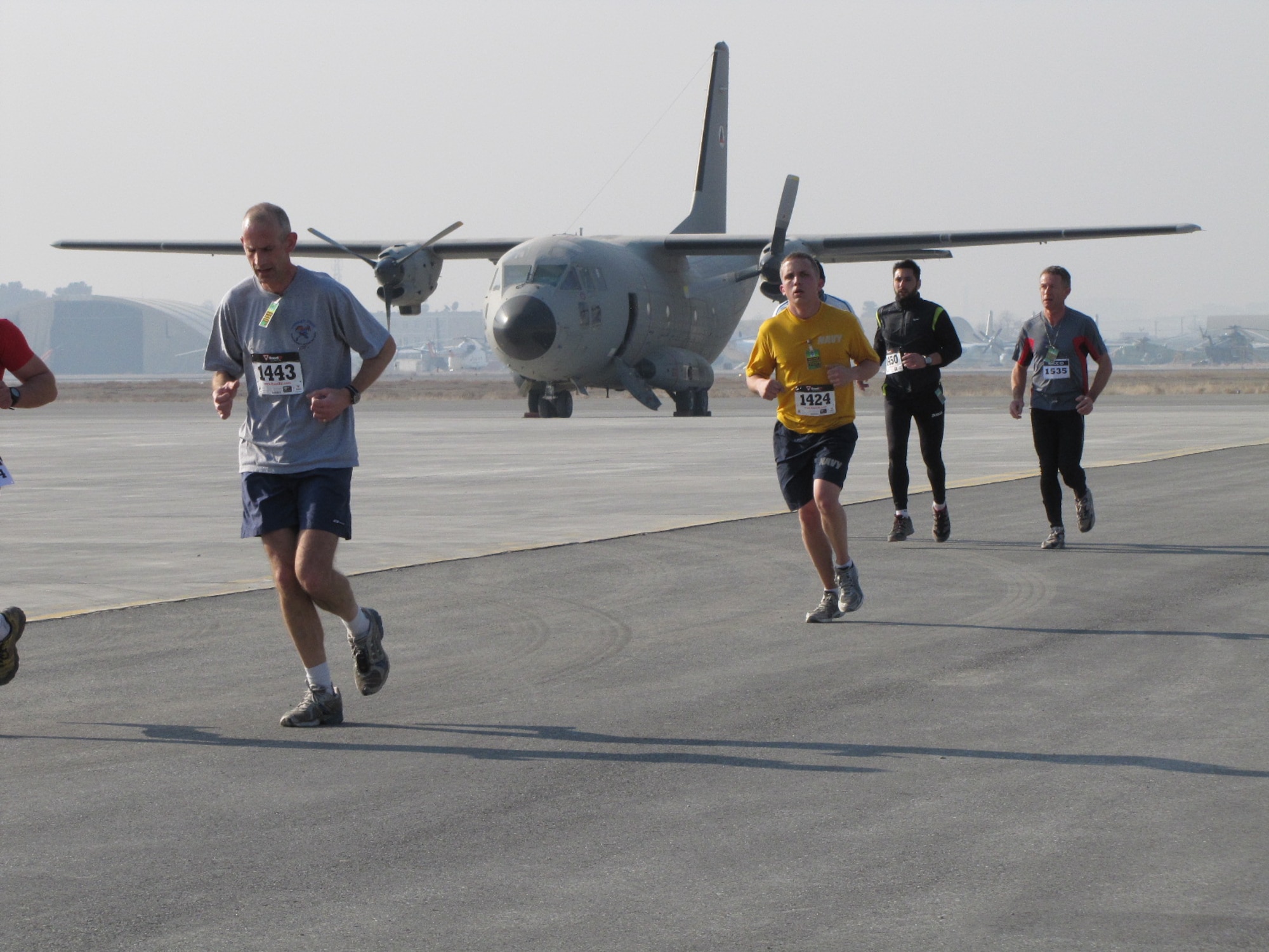 KABUL, Afghanistan - Members of the NATO Air Training Command - Afghanistan and ISAF Joint Command run the annual Fort Worth Cowtown race, one of the largest multi-event road races in the United States, at the Kabul International Airport, Afghanistan Feb 25. (U.S. Air Force photo by Capt. Rob Leese).