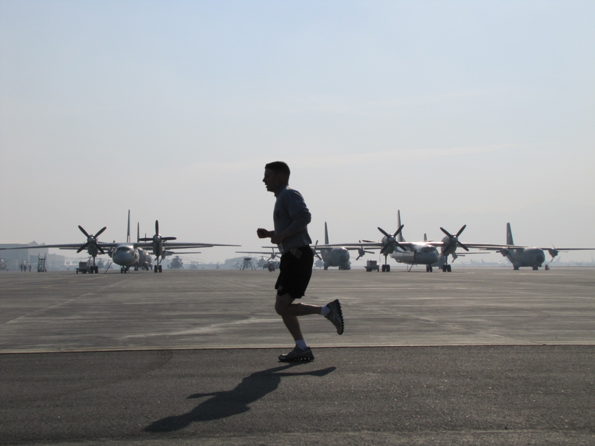 KABUL, Afghanistan - Members of the NATO Air Training Command - Afghanistan and ISAF Joint Command run the annual Fort Worth Cowtown race, one of the largest multi-event road races in the United States, at the Kabul International Airport, Afghanistan Feb 25. (U.S. Air Force photo by Capt. Rob Leese).