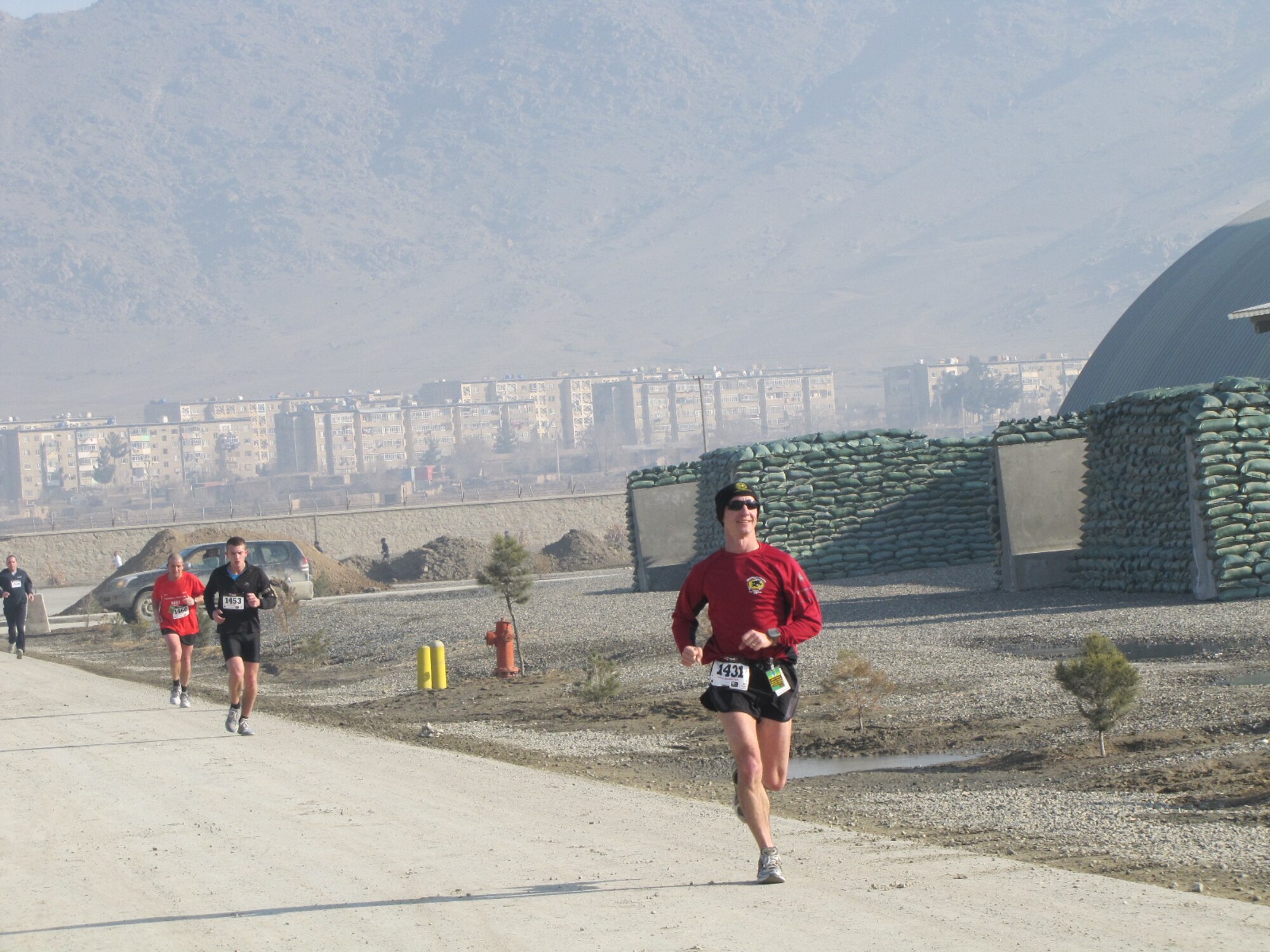 KABUL, Afghanistan - Members of the NATO Air Training Command - Afghanistan and ISAF Joint Command run the annual Fort Worth Cowtown race, one of the largest multi-event road races in the United States, at the Kabul International Airport, Afghanistan Feb 25. (U.S. Air Force photo by Capt. Rob Leese).