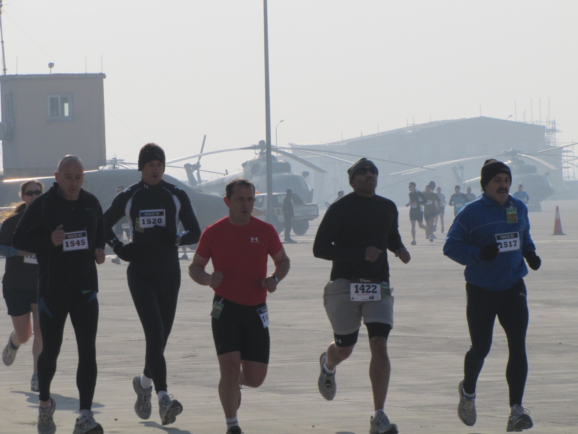 KABUL, Afghanistan - Members of the NATO Air Training Command - Afghanistan and ISAF Joint Command run the annual Fort Worth Cowtown race, one of the largest multi-event road races in the United States, at the Kabul International Airport, Afghanistan Feb 25. (U.S. Air Force photo by Capt. Rob Leese).