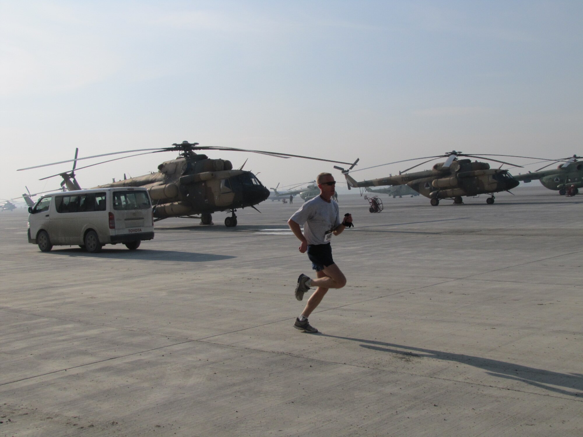 KABUL, Afghanistan - Members of the NATO Air Training Command - Afghanistan and ISAF Joint Command run the annual Fort Worth Cowtown race, one of the largest multi-event road races in the United States, at the Kabul International Airport, Afghanistan Feb 25. (U.S. Air Force photo by Capt. Rob Leese).