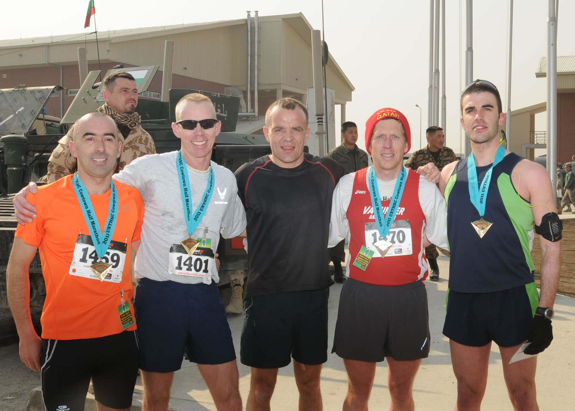 KABUL, Afghanistan - Maj. James Boddy (2nd from the left), race coordinator and participant of the annual Fort Worth Cowtown race, one of the largest multi-event road races in the United States, poses in a photo with the top five finishers at the Kabul International Airport, Afghanistan Feb 25. (U.S. Navy photo by Mass Communications Specialist 3rd Class Jared E. Walker).