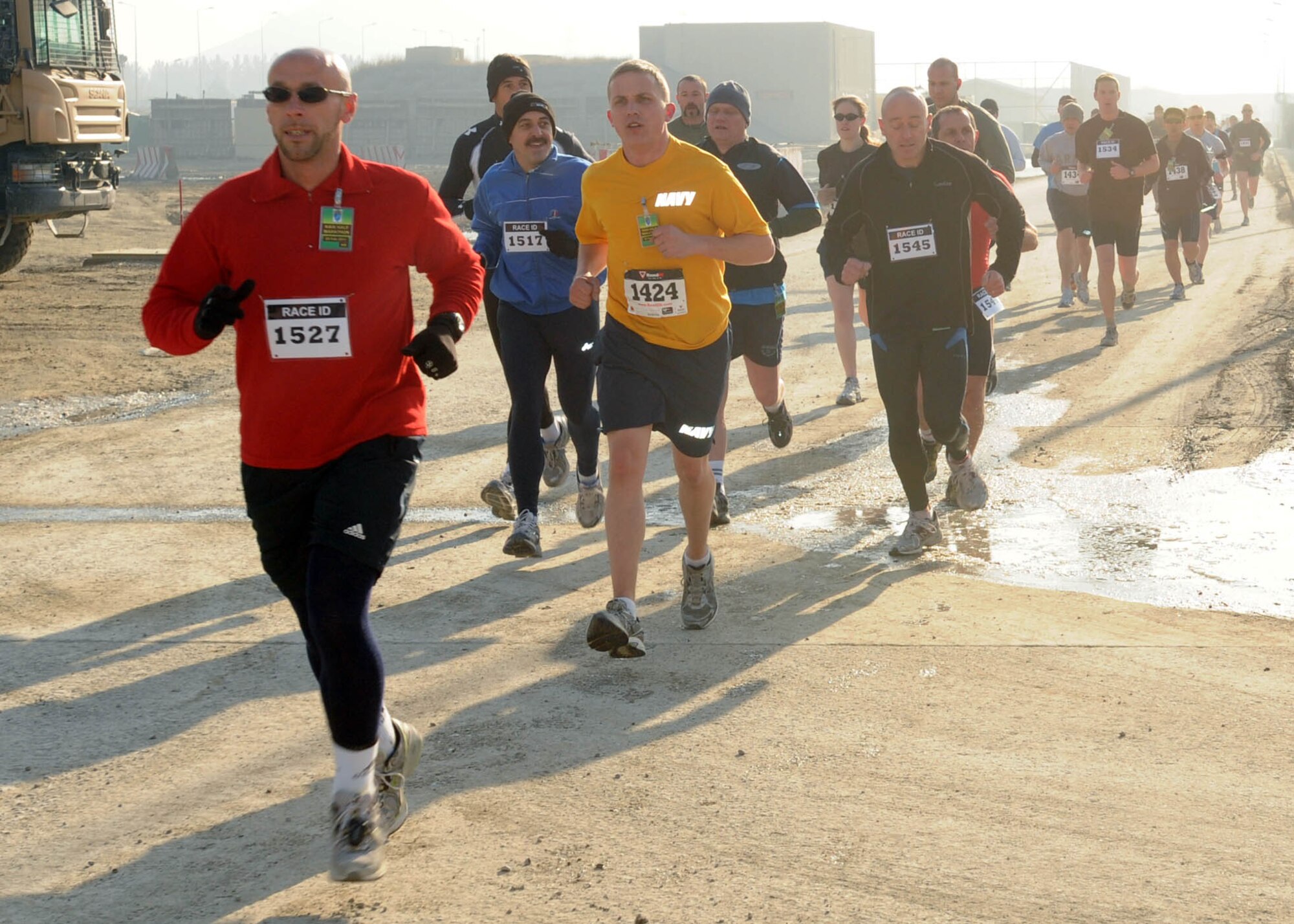 KABUL, Afghanistan - Members of the NATO Air Training Command - Afghanistan and ISAF Joint Command run the annual Fort Worth Cowtown race, one of the largest multi-event road races in the United States, at the Kabul International Airport, Afghanistan Feb 25. (U.S. Navy photo by Mass Communications Specialist 3rd Class Jared E. Walker).