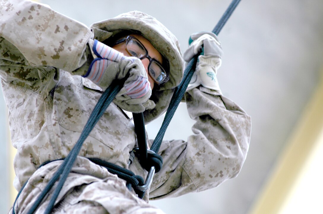 Recruit Paolo Villa, platoon 2173, Company H, drops through the “hell hole.” The recruits drop through a hole in the middle of the rappelling tower platform that simulates a hatch in the body of a helicopter, and fast-rope rappel 100 feet to the ground below.