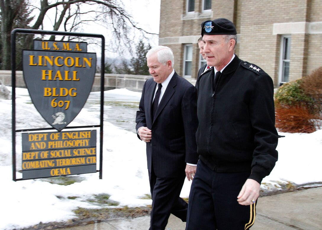 Defense Secretary Robert M. Gates walks out of Lincoln Hall with U.S. Army Lt. Gen. David H. Huntoon Jr., West Point superintendent, after teaching two political science classes at the U.S. Military Academy, West Point, N.Y., Feb. 25, 2011.