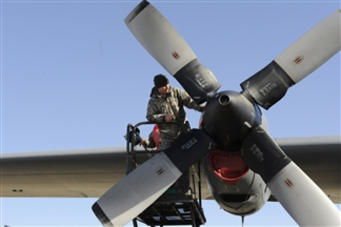 Staff Sgt. Scott Grgurich troubleshoots a C-130 Hercules engine problem during an exercise at Pope Air Force Base, N.C., on Feb. 9, 2011.  Grgurich is a C-130 maintainer assigned to 43rd Aircraft Maintenance Squadron.  