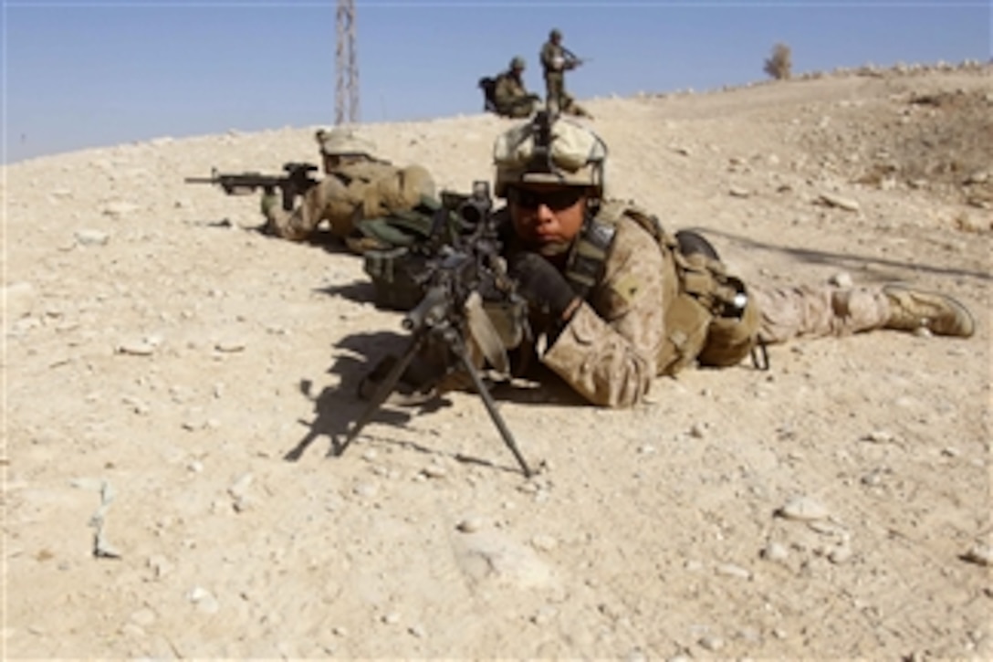 U.S. Marine Corps Lance Cpl. Nicholas Kien (right) and Lance Cpl. William Brancalasso (left), both with 2nd Platoon, Lima Company, 3rd Battalion, 5th Marine Regiment, Regimental Combat Team 2, provide security during a patrol in the Sangin district of Helmand province, Afghanistan, on Jan. 25, 2011.  The Marines conducted patrols to suppress insurgent activity and gain the trust of Afghan citizens.  The battalion was one of the combat elements of Regimental Combat Team 2, whose mission was to conduct counterinsurgency operations in partnership with the International Security Assistance Force.  