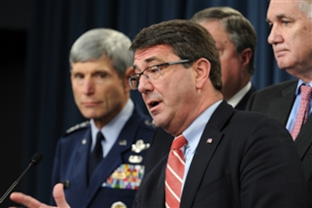 Under Secretary of Defense for Acquisition, Technology & Logistics Ashton B. Carter speaks with members of the press about the KC-X contract announcement during a briefing with Air Force Chief of Staff Gen. Norton A. Schwartz (left), Secretary of the Air Force Michael B. Donley and Deputy Secretary of Defense William J. Lynn III in the Pentagon on Feb. 24, 2011.  