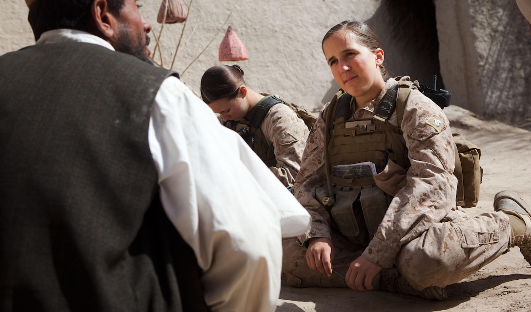 Sgt. Meredith Burns, the team leader of 2nd Battalion, 3rd Marine Regiment’s Female Engagement Team, speaks to a local of Nawa District, Helmand province, Afghanistan, about taking advantage of services offered by the local government, Feb. 26. Burns is a native of West Pittston, Pa.