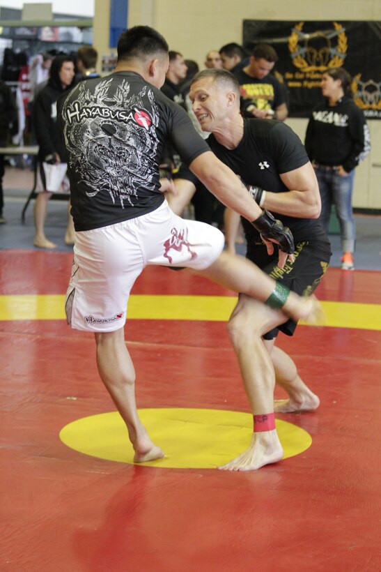 Bill Harrington [right], a fighter with Fight Club 29, tackles his opponent during the Camp Pendleton Pankration Invitation Feb. 26, 2011, in San Mateo, Calif.