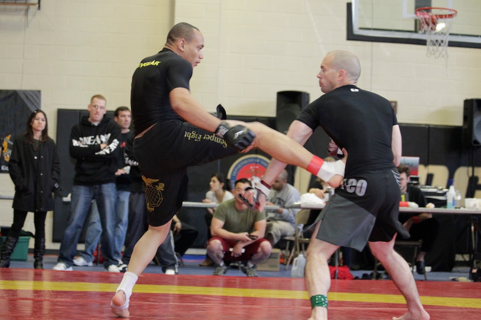 Arthur Powell, a fighter with Fight Club 29, front kicks his opponent during the Camp Pendleton Pankration Invitation Feb. 26, 2011, in San Mateo, Calif. Powell went on to win the gold medal in the 160 pound bracket.