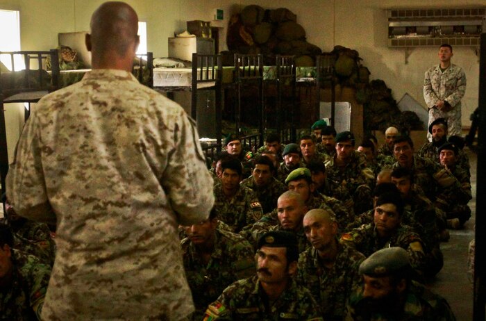 1st Sgt. Chester Wilson III, company first sergeant, Support Company, Combat Logistics Battalion 3, 1st Marine Logistics Group (Forward), speaks to Afghan National Army soldiers during a Leadership Shura aboard Camp Shorabak, Afghanistan, Feb. 26. The Leadership Shura, organized by Marines with CLB-3's Embedded Partnering Team, was carried out in order to enhance the ANA's leadership capabilities.