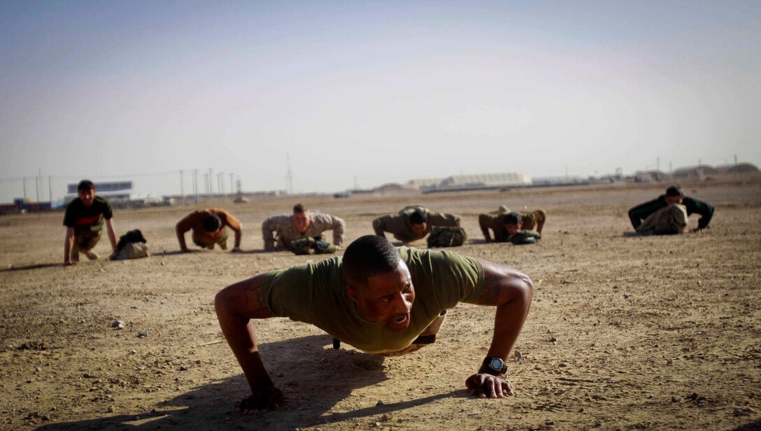 1st Sgt. Alexander K. Lamberth, company first sergeant Headquarters and Service Company, Combat Logistics Battalion 3, 1st Marine Logistics Group (Forward), leads Afghan National Army soldiers during a physical training sessions as part of a Leadership Shura aboard Camp Shorabak, Afghanistan, Feb. 26. The Leadership Shura, organized by Marines with CLB-3's Embedded Partnering Team, was carried out in order to enhance the ANA's leadership and operational capabilities.