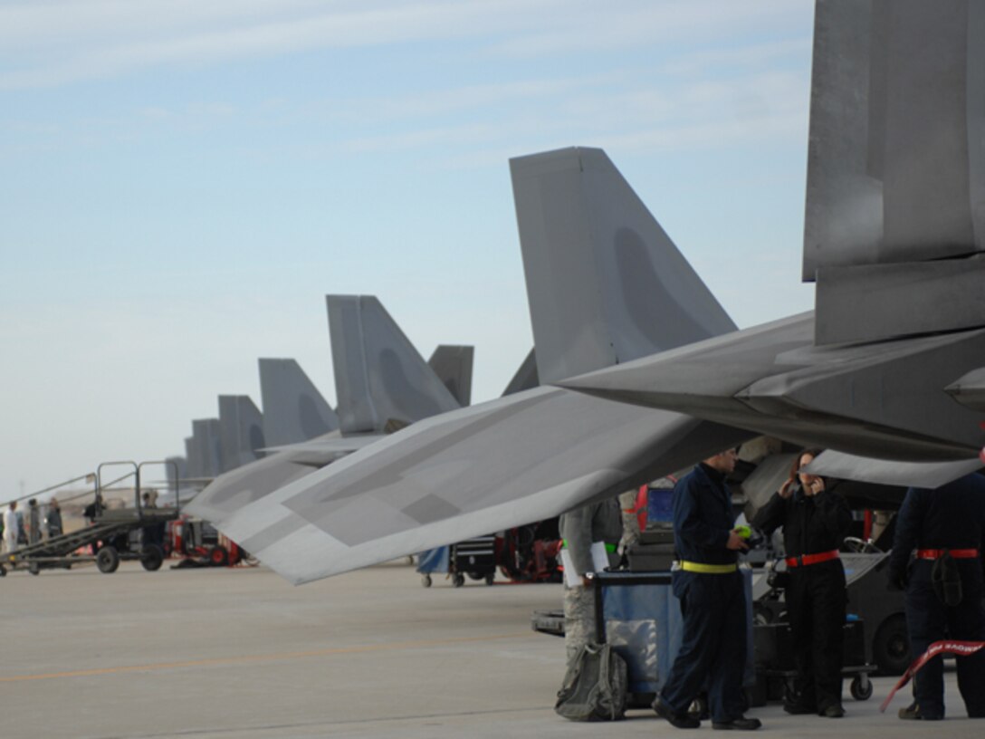 Airmen from the 1st and 192d Fighter Wings prepare F-22 Raptors during an Operational Readiness Exercise at Langley Air Force Base, Va., Feb. 26, 2011. Personnel from the 633d Air Base Wing, 1 FW and 192 FW participated in the two-day exercise, designed to gauge the wing's ability to deploy Airmen, aircraft and cargo within a limited timeframe. (U.S. Air Force photo by Airman 1st Class Teresa Zimmerman/Released)