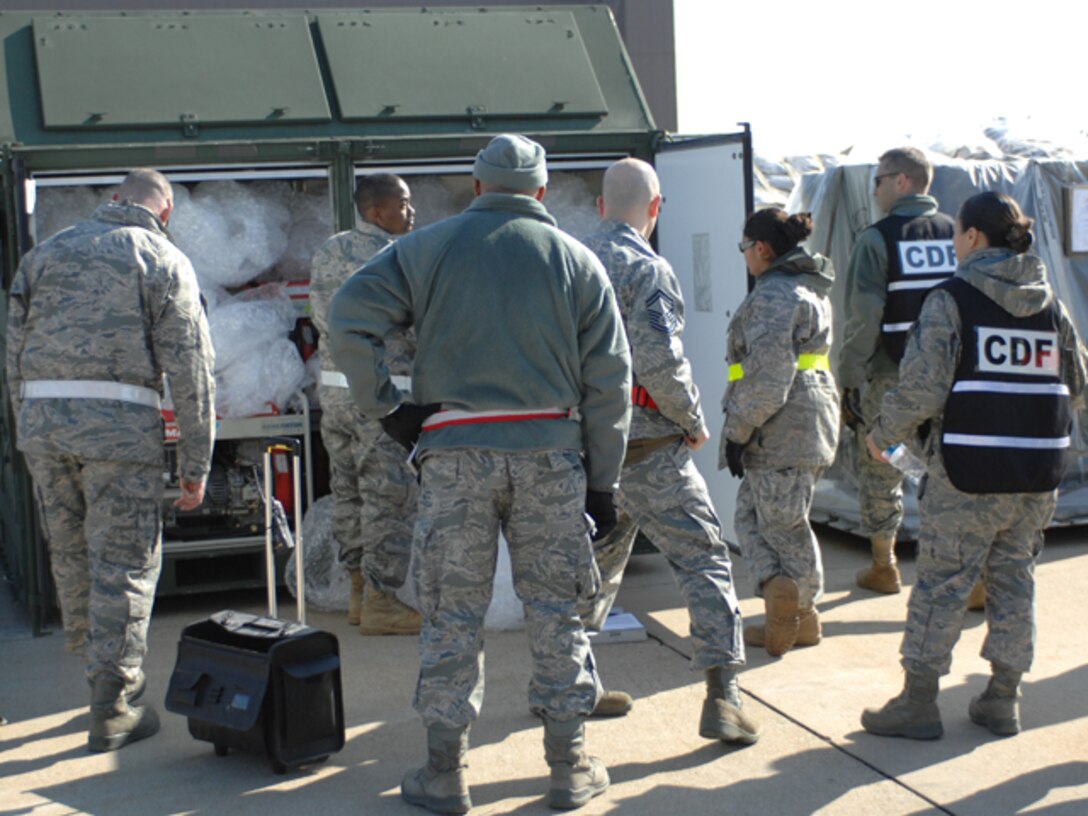 Airmen inspect a cargo shipment during an Operational Readiness Exercise at Langley Air Force Base, Va., Feb. 26, 2011. Personnel from the 633d Air Base Wing, 1st Fighter Wing and 192d Fighter Wing participated in the two-day exercise, designed to gauge the wings' ability to deploy Airmen, aircraft and cargo within a limited timeframe. (U.S. Air Force photo by Airman 1st Class Teresa Zimmerman/Released)
