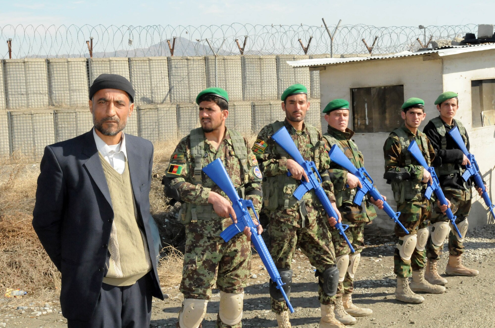 KABUL, Afghanistan - Members of the Afghan Air Force practice basic apprentice security force training and entry control procedures at Pohantoon-e-Hawayee, the Afghan Air Force's "Big Air School", on the Afghan Air Force base in Kabul, Afghanistan Feb. 24. (U.S. Navy photo by Mass Communications Specialist 3rd Class Jared E. Walker)