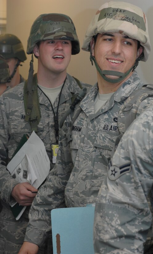 Airman 1st Class Mackenzie Cunningham and Airman 1st Class David Ames,  1st Maintenance Squadron journeyman  check-in to process through the deployment line at during an Operation Readiness Exercise Langley Air Force Base, Va, Feb. 27, 2011. Wing exercise evaluation team members assessed the 1st Fighter Wing, 633d Air Base Wing, and 192d Fighter Wing’s readiness to deploy in a short time frame. (U.S. Air Force photo by Senior Airman Antoinette Gibson/Released)