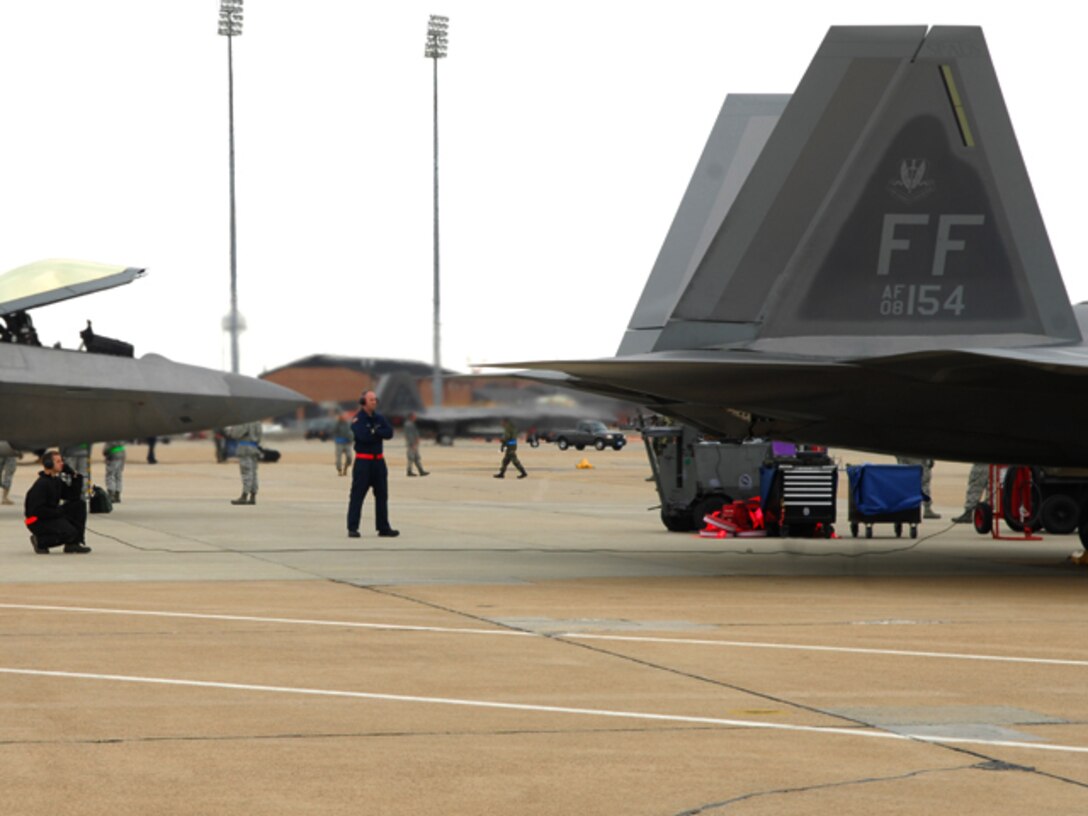 Staff Sgt. Hugh Price and Airman 1st Class Nicholas Russell, 94th Aircraft
Maintenance Unit F-22A Raptor crew chiefs inspect an F-22 prior to flight at
Langley Air Force Base, Va., Feb. 27, 2011. Part of a two -day exercise, Langley
Airmen from the 633d Air Base Wing, 1st Fighter Wing and 192nd Fighter Wing
worked together to practice deploying people, equipment and aircraft for
contingency operations on a moment's notice.(U.S. Air Force photo by Airman
1st Class Camilla Elizeu/Released)  
