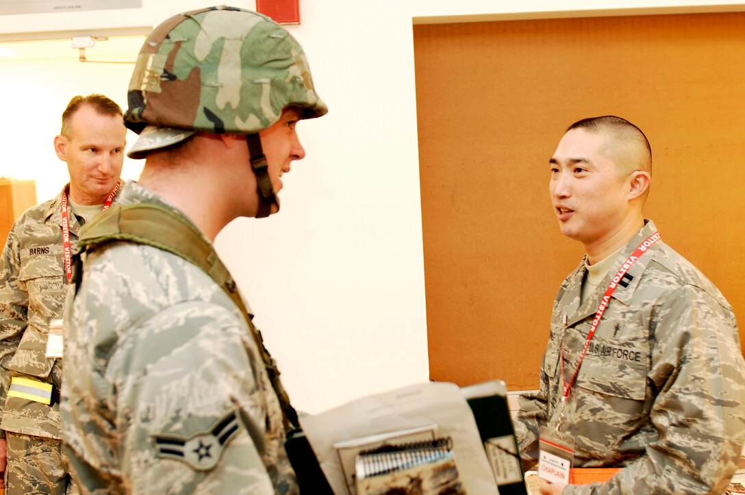 Capt. Asa Chung, 633d Air Base Wing Chaplain, speaks to the Airmen deploying in an Operational Readiness Exercise at Langley Air Force Base, Va., Feb. 27, 2011. The Airman Family and Readiness Center and Chaplain stations were made available to Airmen processing through the deployment function line during a two-day exercise to test the ability of Airmen to deploy in a short notice. (U.S. Air Force photo by Airman 1st Class Kayla Newman/Released)