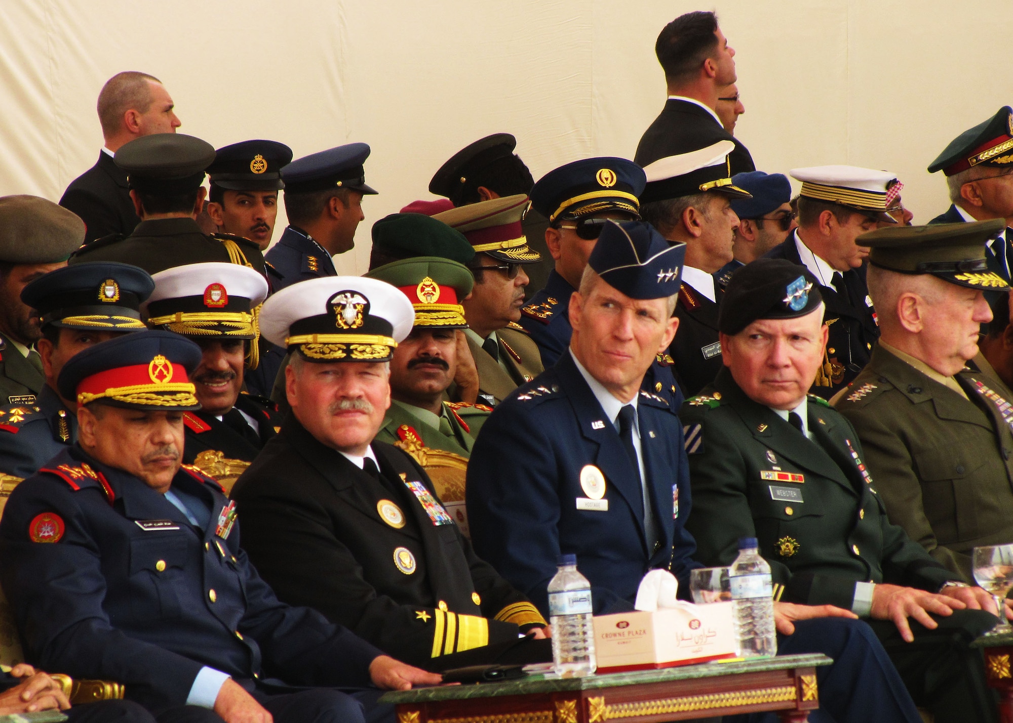 Lt. Gen. Michael Hostage III, commander of the U.S. Air Forces Central Command in Southwest Asia, (third from left) sits among some of the world's leaders and top dignitaries during Kuwait's 50/20 Celebration. Kuwait celebrated their 50th year of independence from Great Britain and 20th year of liberation from Saddam Hussein’s invading forces with several coalition countries, including the U.S., by staging a very large military parade, Feb. 26. Numerous aircraft flew over the parade grounds to kick off the two-hour long parade, which included tanks, rocket launchers, multi-barrelled guns, and military formations of servicemembers from countries, such as Kuwait, the U.S., U.K., France, Saudi Arabia, Syria, and Qatar. (U.S. Air Force photo by Staff Sgt. Angelique N. Smythe)