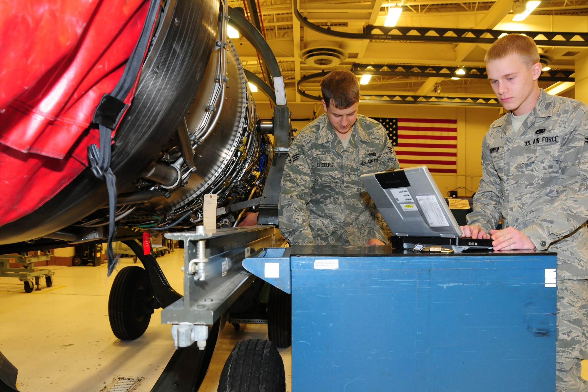 Senior Airman John Broberg and Airman 1st Class Matthew McEwen conduct repairs on a dismantled F-16 Block 50engine.  The engine repairs were being completed at the 148th Fighter Wing in Duluth Minn. Feb. 26, 2011.  (U.S. Air Force photo by Staff Sgt. Donald Acton/released)
